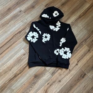 Black denim tear hoodie with white flowers